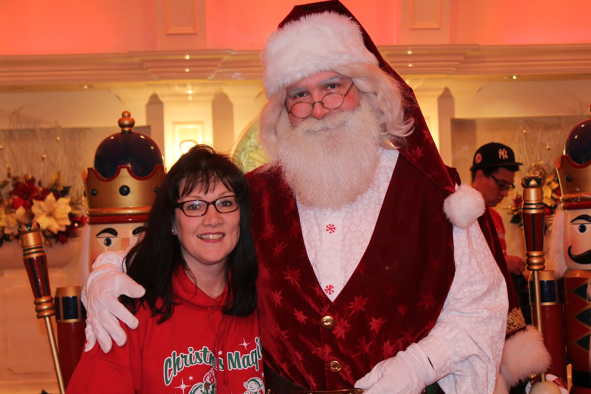 Christmas Magic Santa and woman with branded sweatshirt